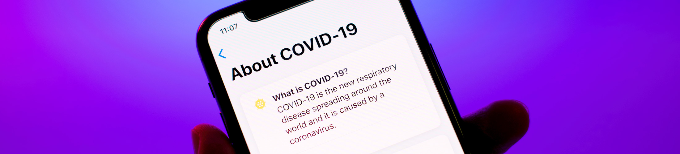 A smartphone showing a short definition of Covid-19