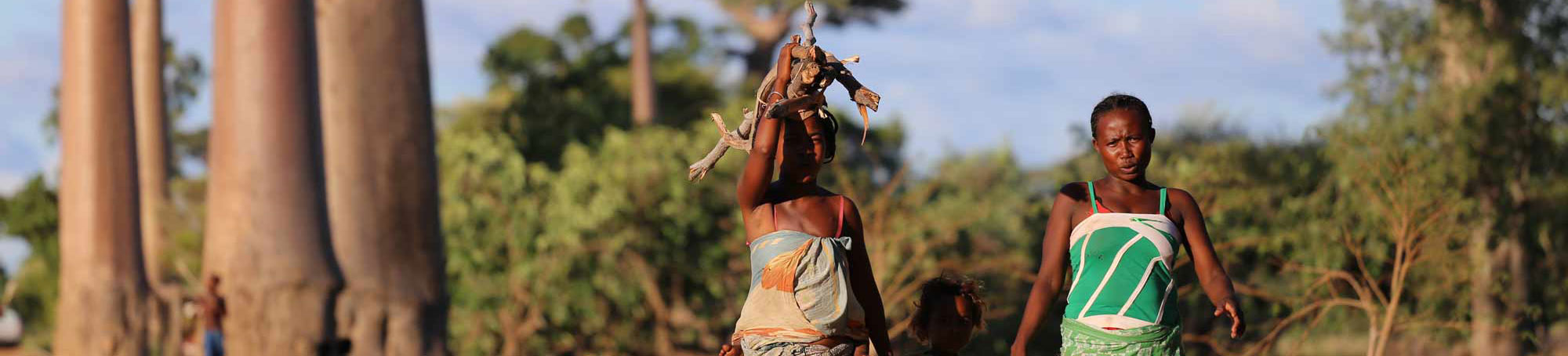 Two women in Africa with Baobab trees in the background