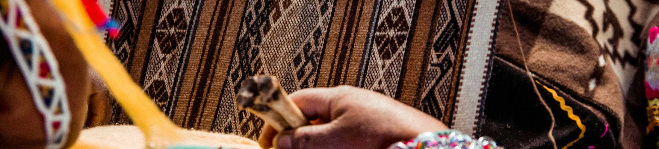 A woman with colorful strips of fabric