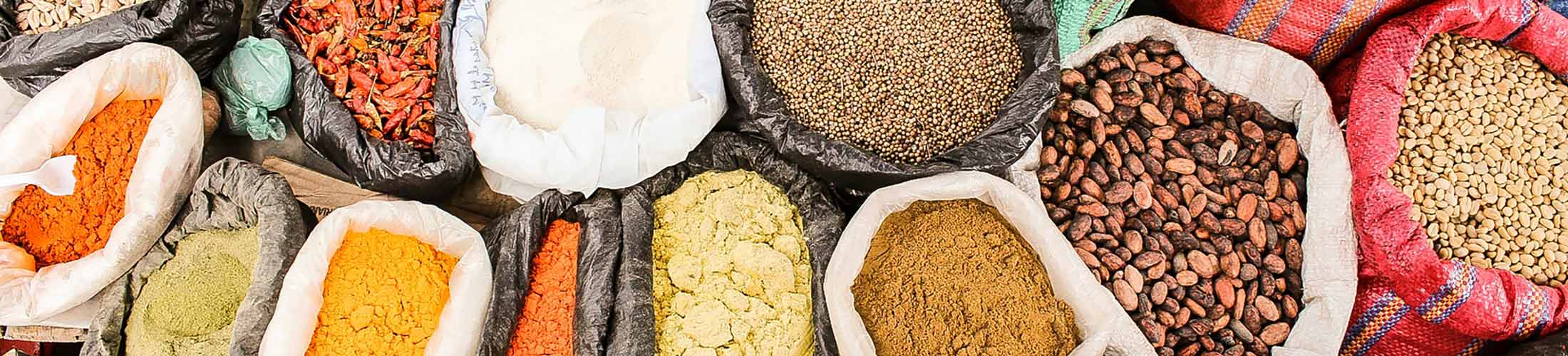 Fabric containers with spices photographed from above