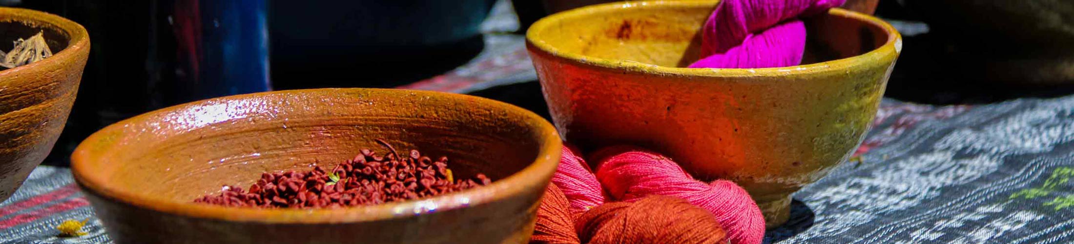 Bowls with spices and colorful wool
